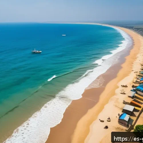Home 17 가나에서 드론 촬영이 가능한 지역 - Aerial view of Ghana’s golden sandy coastline under a clear blue sky, capturing the contrast between...
